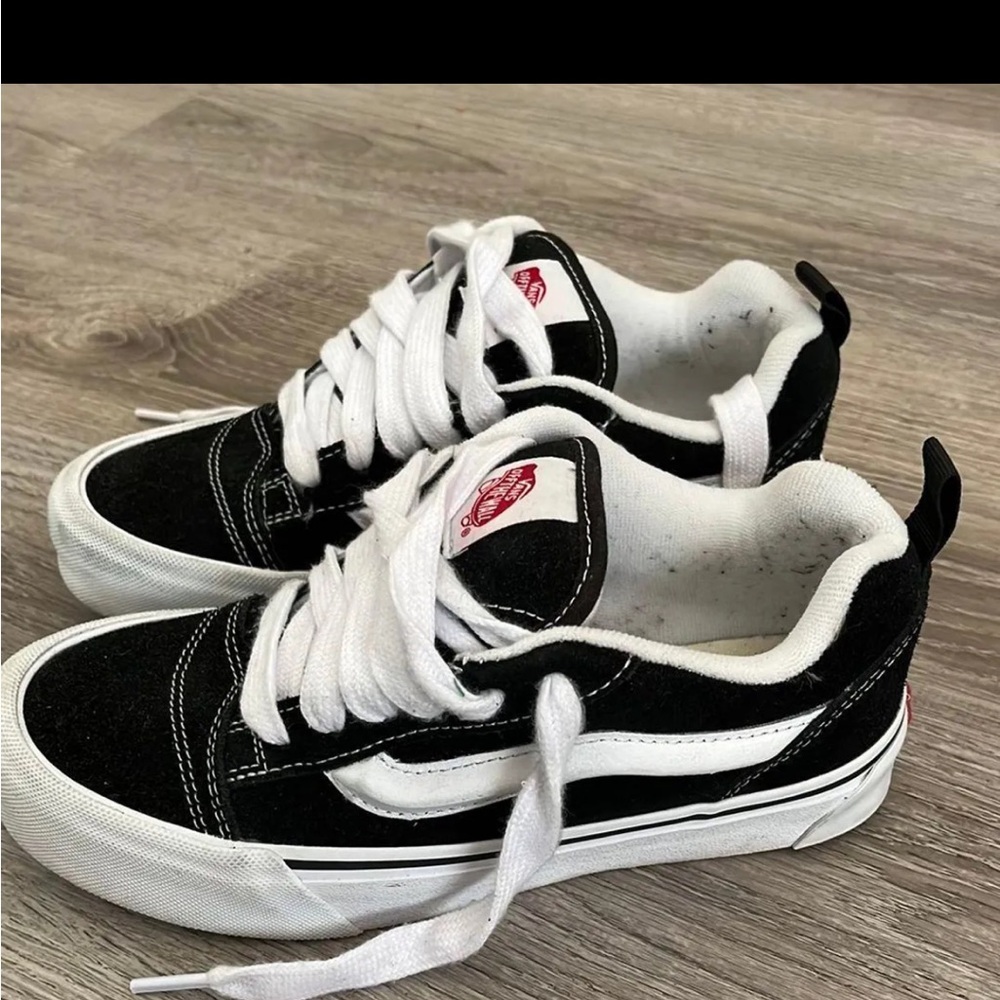 Black and White Sneakers with Red Logo